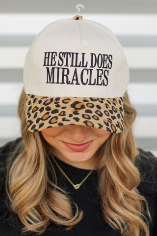 He Does Miracles Trucker Hat