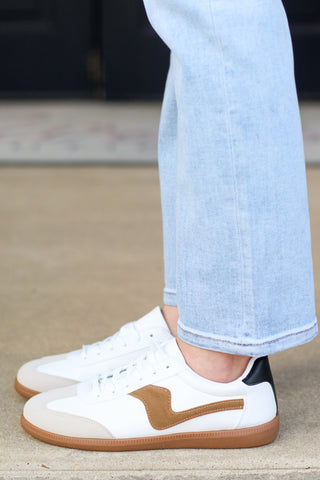 white and brown sneakers