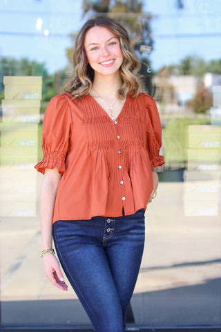 pleated button up top