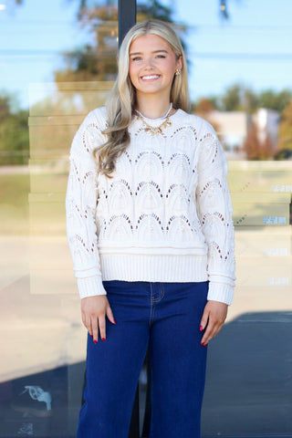white sweater with pearls