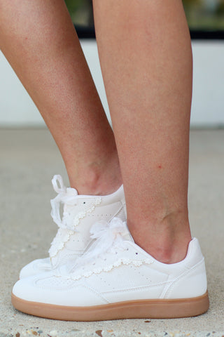 beige sneakers with lace trim details